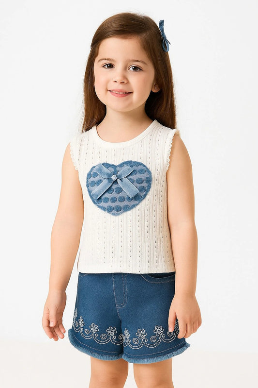  white sleeveless top with a blue heart and shorts